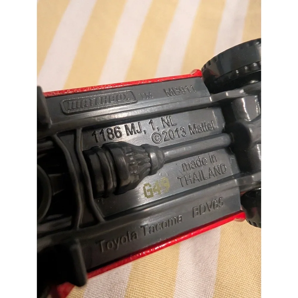 Matchbox 2014 Toyota Tacoma Lifeguard Red Heroic Rescue 1:64 Diecast Truck #105
